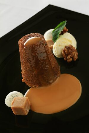 plated gourmet sweet steamed toffee sponge dessertの写真素材