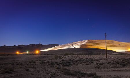 Modern strip mine in the Nevada desert at night.の写真素材