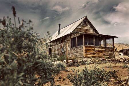 Old Ghost Town Cabin in the Nevada Desert. Image has a vintage color tone.の写真素材
