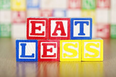 Eat Less Spelled Out in Alphabet Building Blocksの写真素材