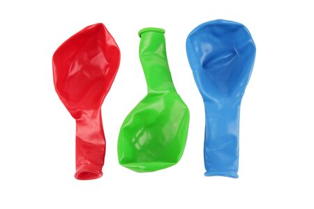 Red Green and Blue Deflated Balloons Cutoutの写真素材