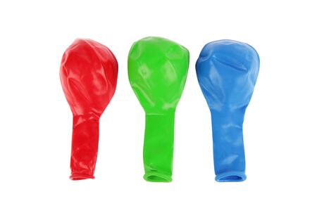 Deflated red, green and blue Balloonsの写真素材