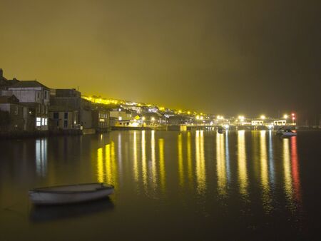 Night image of the reflections of Prince of Wales Pier, Falmouth, Cornwall, UKの写真素材