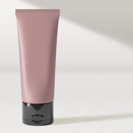 Blank pink cosmetic tube mockup on white background. 3D renderingの写真素材
