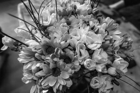 black and white bouquet of many different flowers made by florist designer, useful for birthday present, weddings, funerals, anniversaries and just to make happy some close and beloved people.の写真素材