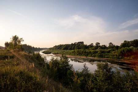 Landscape with the image of the river in the evening light. Saka river, Latviaの写真素材