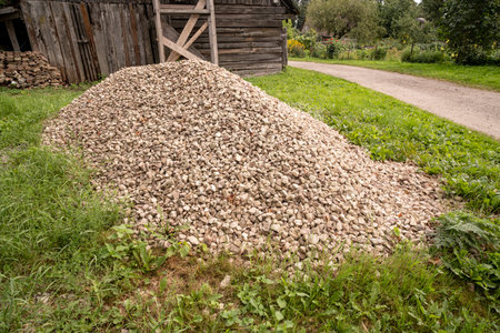 Pile of pebbles in the yard of a country houseの写真素材