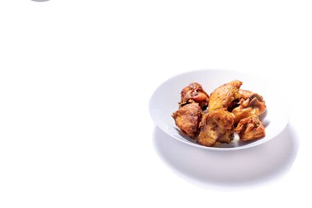 Fried Chicken on a plate with isolated white shotの写真素材