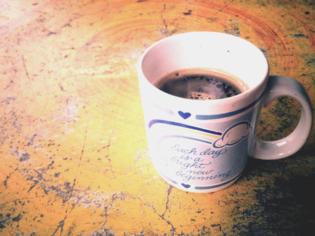 Black coffee on an old tableの素材