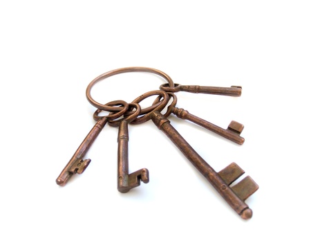 vintage skeleton keys on ring over isolated over white backgroundの写真素材