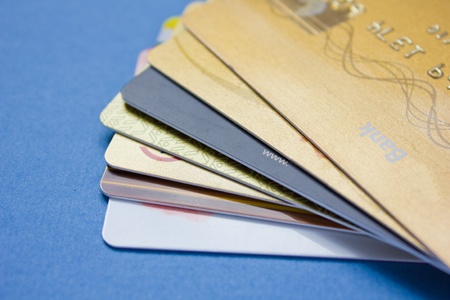 pile of credit cards on blue backgroundの写真素材