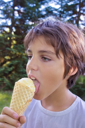 boy licking ice creamの写真素材