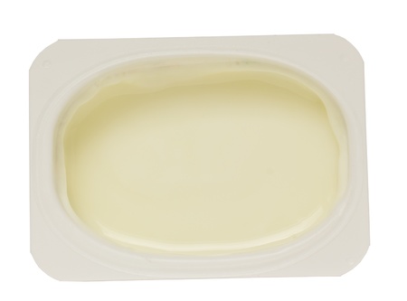 white yoghurt in plastic container isolated on white backgroundの写真素材
