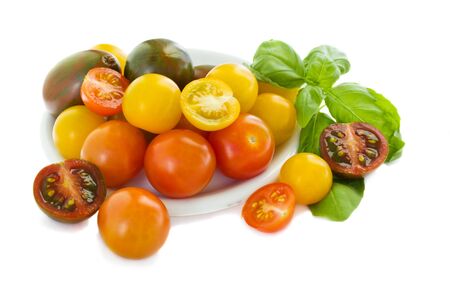 multicolored cherrry tomatoes isolated on white backgroundの写真素材