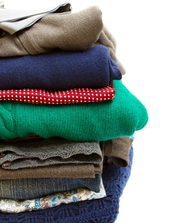 pile of multicolored clothes on white backgroundの写真素材