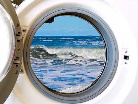 washing machine with colored clothesの写真素材
