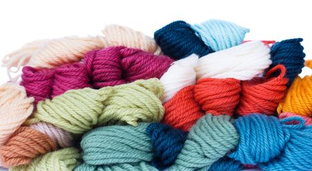 pile of woolen yarns isolated on white background
