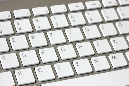 white and metalic modern keyboard with letters 