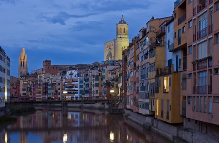 old town of Girona on river Onyar at night, Spainの写真素材