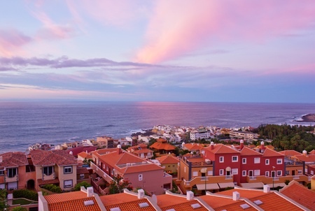 houses Puerto de la Cruz by the ocean at sunset, Tenerife, Spainの写真素材