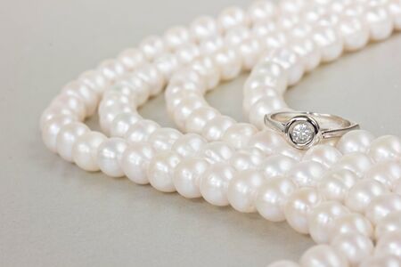 diamond ring on white pearls  abstract backgroundの写真素材