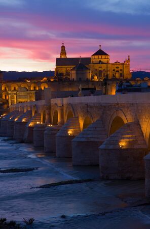 Mezquita and roman bridge at sunset, Cordoba, Andalusia, Spainの写真素材
