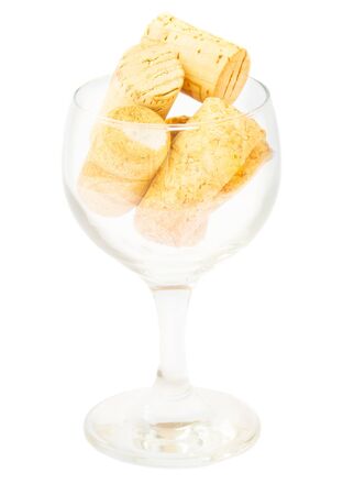 empty wine  glass with corks isolated on white backgroundの写真素材