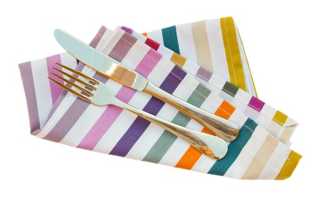 knife and fork close up on napkin isolated on white backgroundの写真素材