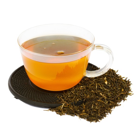 transparent cup of tea with raw tea isolated on white backgroundの写真素材