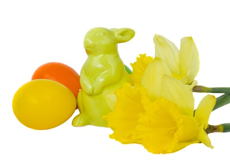 easter bunny with eggs and flowers isolated on whiteの写真素材
