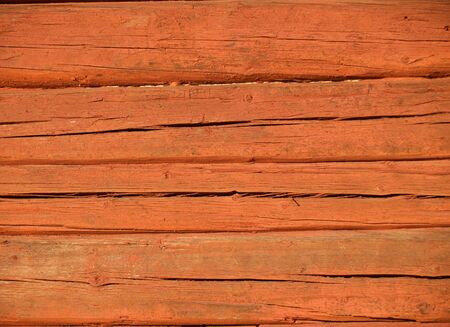 background of wooden textured red colored planks の写真素材