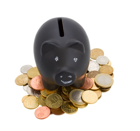 piggy bank with cions isolated on white backgroundの写真素材