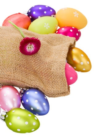 pile of easter easter eggs in pouch  isolated on white backgroundの写真素材