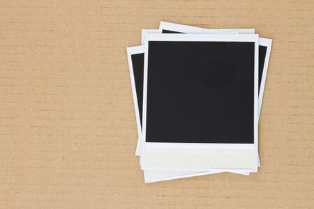pile of blank instant photo on carton backgroundの写真素材