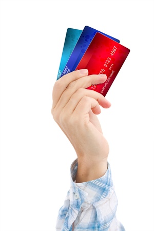 hand holding credit cards isolated on white backgroundの写真素材