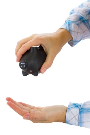 lack of money concept  - female hand shaking empty money pigの写真素材
