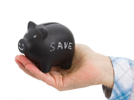 human hand holding  smiling money pig isolated on white backgroundの写真素材