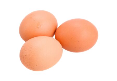 raw brown eggs isolated on white backgroundの写真素材