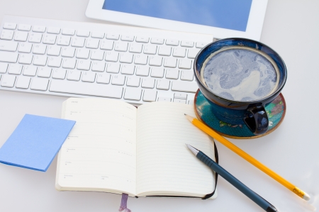 open blank note pad with stationery  on working tableの写真素材