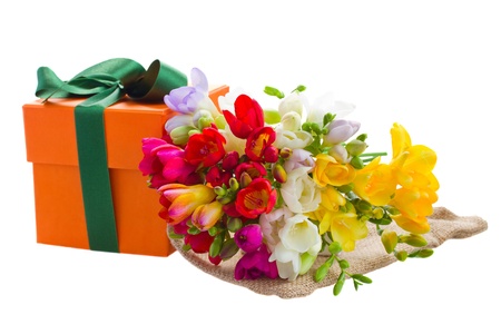 freesia flowers and  gift box isolated on white backgroundの写真素材