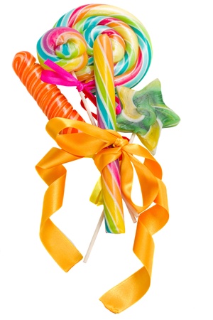 pile  of multicolored caramel candies isolated on white backgroundの写真素材