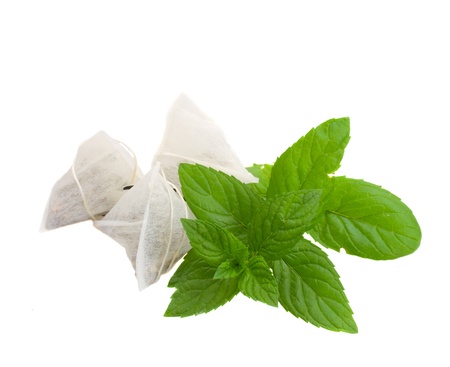 tea bags with mint herb isolated on white backgroundの写真素材