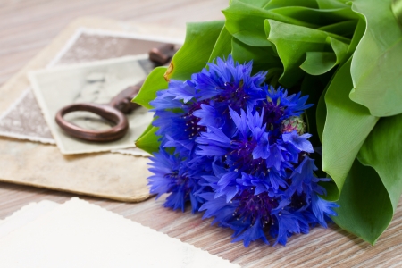 old photos, vintage key  and corn flowersの写真素材