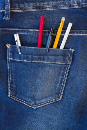blue jeans pocket full of  pens and pencils - back to school conceptの写真素材