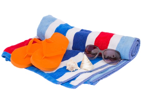 beach towel and sandals isolated on white backgroundの写真素材