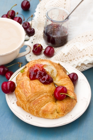 breakfast with  fresh croissants and  chery berriesの写真素材