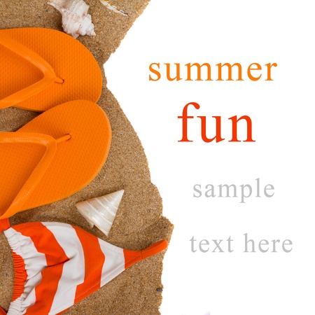 orange flip flops and swimming suit on sand  isolated on white backgroundの写真素材