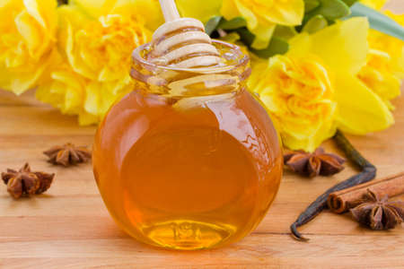 jar of floral honey   on wooden tableの写真素材