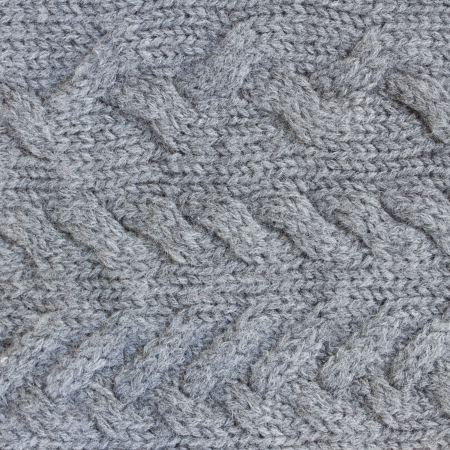 background of knitted woolen gray sweater textureの写真素材