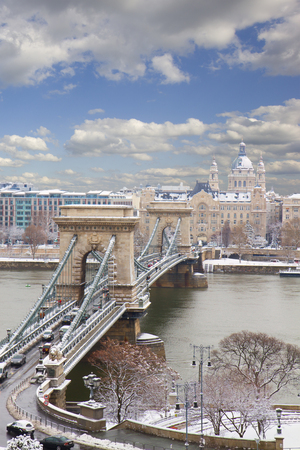 Chain Bridge  Szechenyi lanchid  and Pest skyline at winter day in Budapest, Hungaryの写真素材